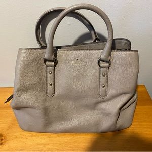 Beige Kate Spade handbag. Does not have shoulder strap.